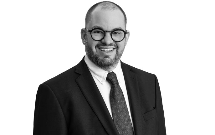 Dr. Matthew J. Ramsey, President & CEO Target Community & Educational Services, Inc. Laurence J. Adams Endowed Chair and Professor, McDaniel College Man wearing a suit and tie, smiling at the camera in a black-and-white studio portrait.